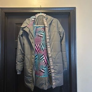 Like new Ivivva hooded winter coat.   Grey with patterned Inside